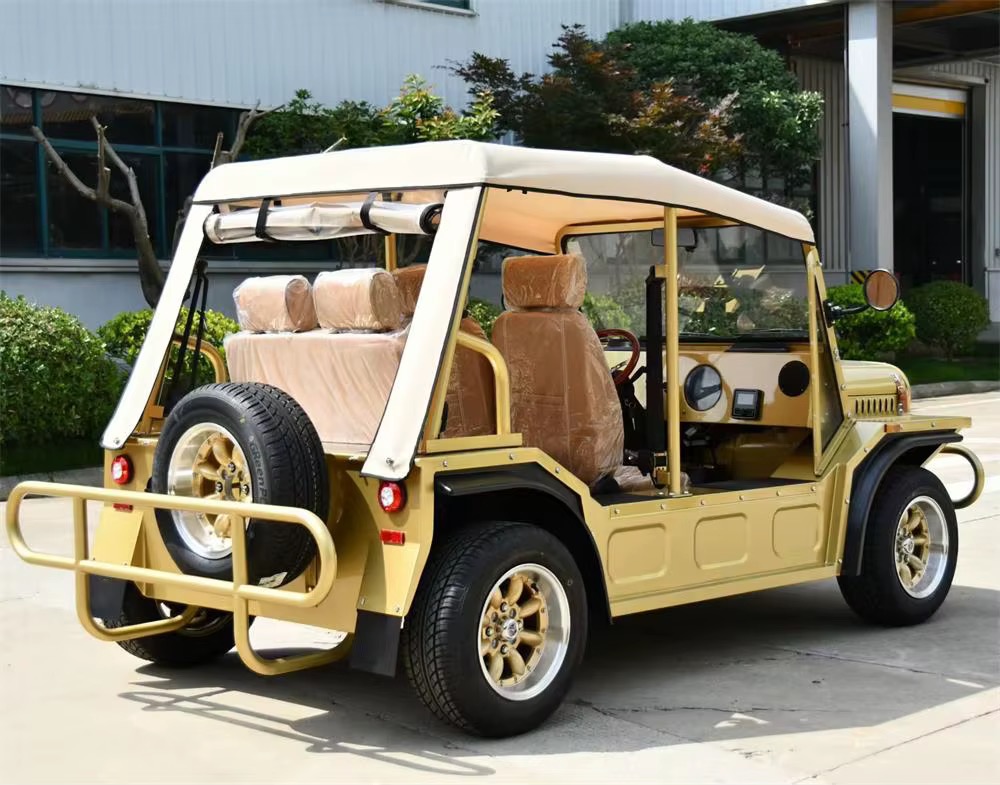Gold Capri electric vehicle viewed from the rear quarter