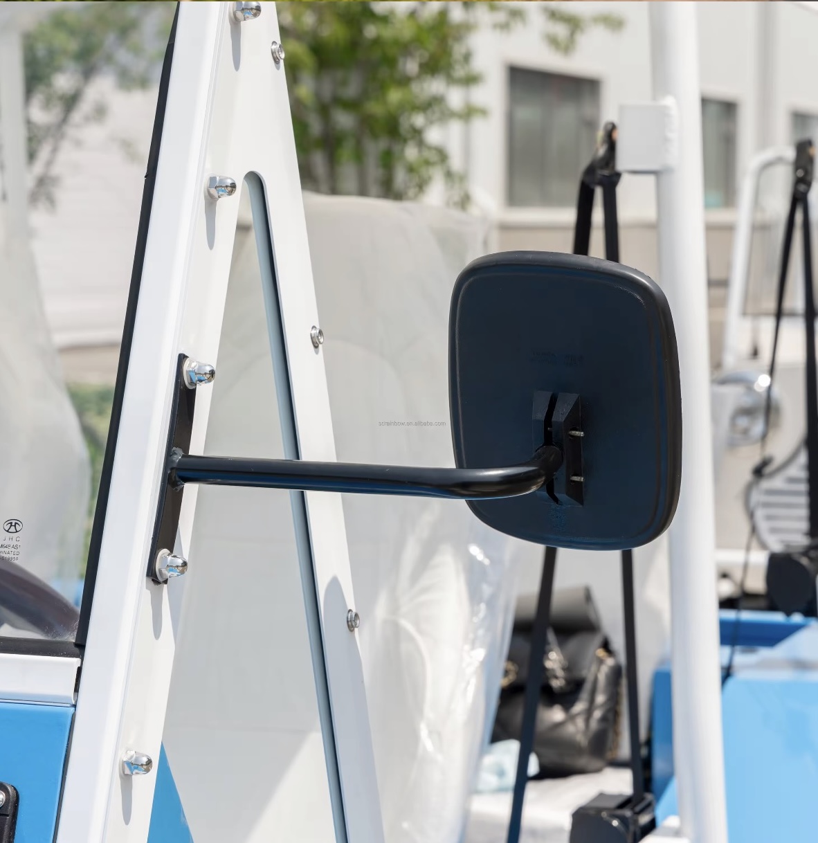 Capri side mirror and open-air cabin detail