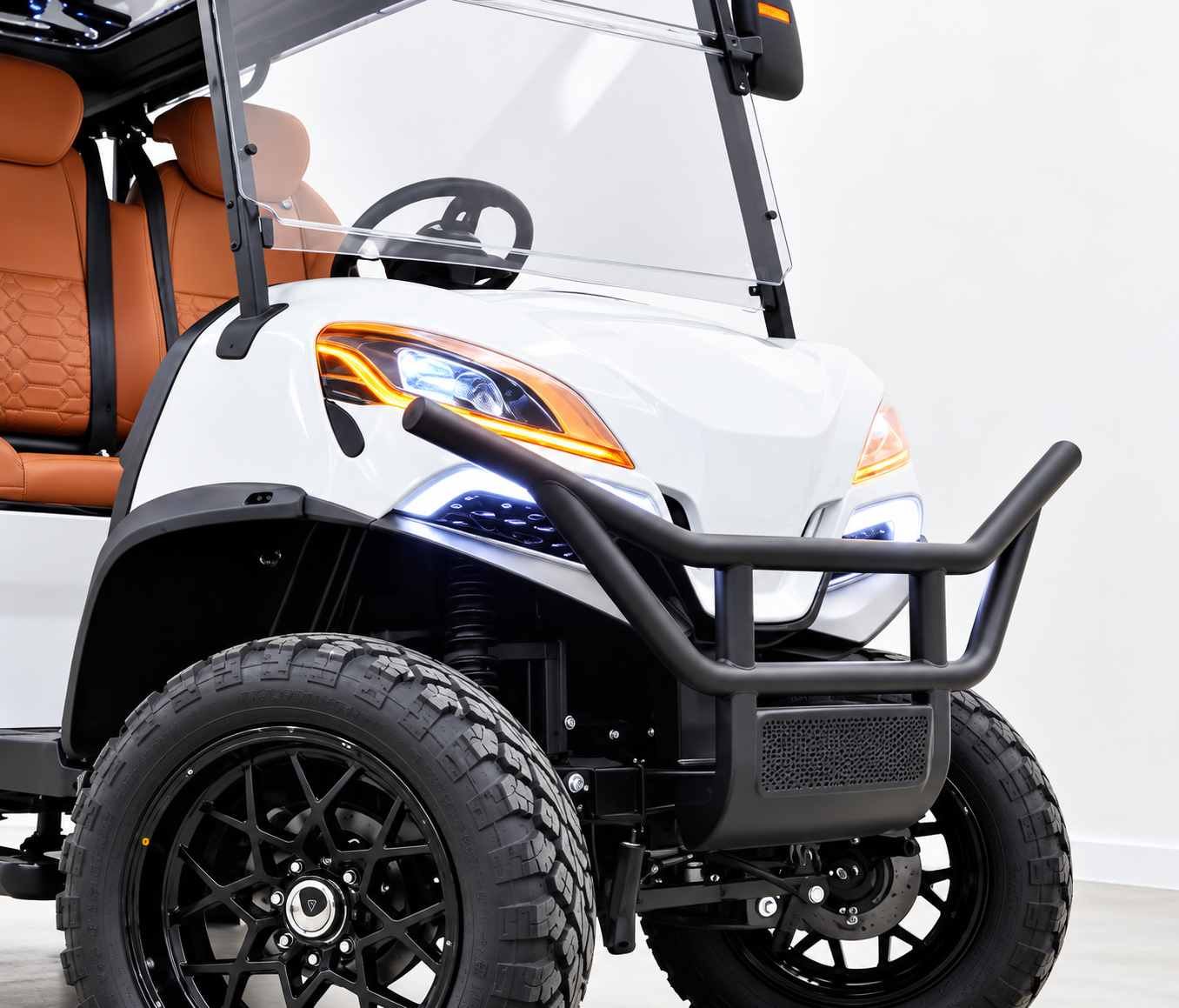 Monaco front fascia: LED signature headlights with black bull bar on a white luxury golf cart