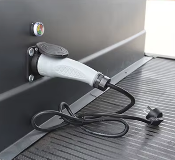 Monaco FF4 side charging port with charger plugged in
