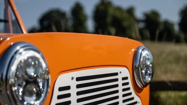 Orange Capri front end with round LED headlights and white grille
