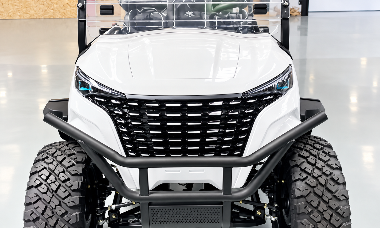 Azur front fascia: full-width black grille with bull bar on a white luxury golf cart