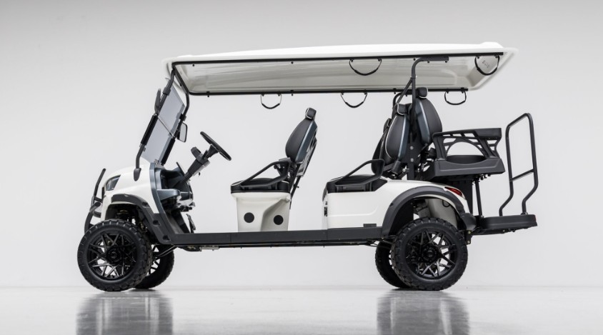 Six-passenger luxury electric golf cart used for guest transport at a resort